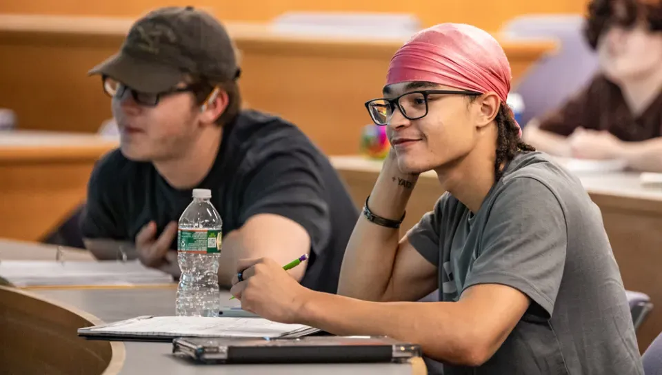 Two students sitting in a Criminology lecture